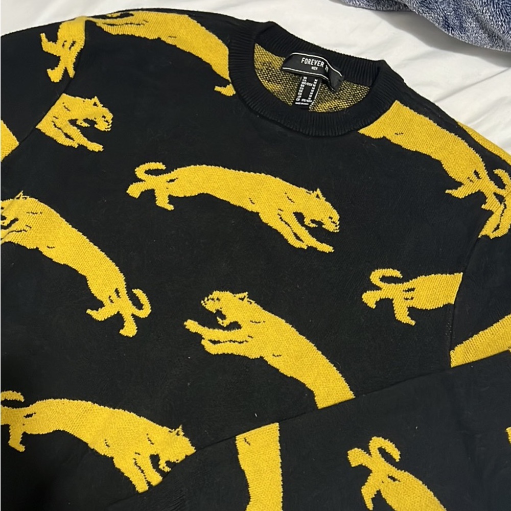 Black and yellow chetah sweater size M
